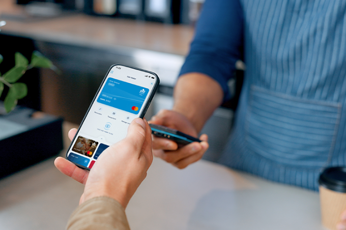 A person is using Kate Wallet in the KBC Brussels Mobile app on a smartphone 